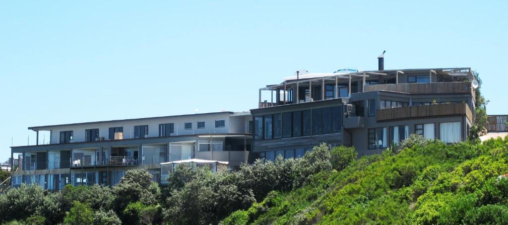 a building on top of a hill at Wilderness Beach Views in Wilderness