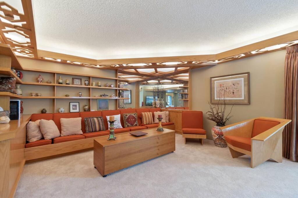 a living room with a couch and a table at Frank Lloyd Wright Condo at Biltmore Golf Course in Phoenix