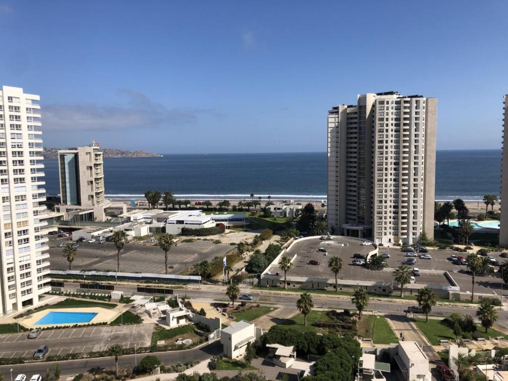 a view of a city with tall buildings and the ocean at Departamento Sector Casino Enjoy in Coquimbo
