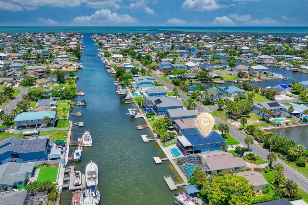 an aerial view of a marina with houses and boats at Waterfront home with pool and gameroom! in Hernando Beach