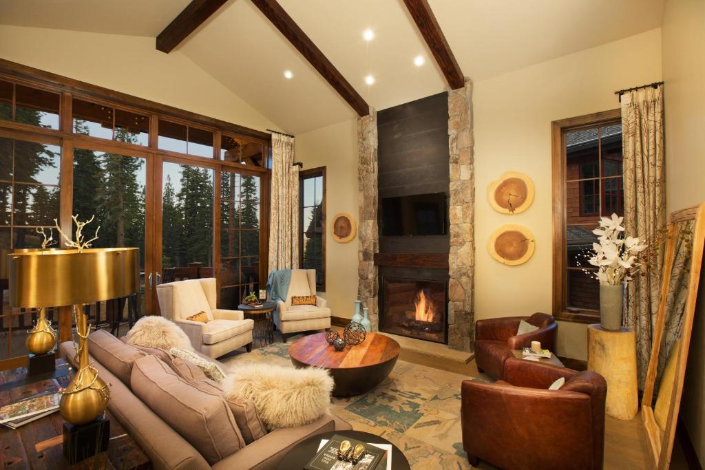 a living room with a couch and a fireplace at Mountainside - Luxury Northstar Ski-in Ski-Out - Swimming Pool and Gym! in Truckee