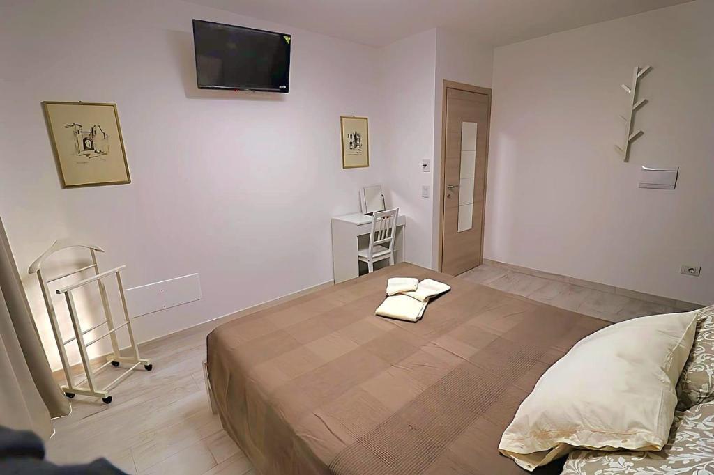 Postel nebo postele na pokoji v ubytování SENTIERI DEL GARDA