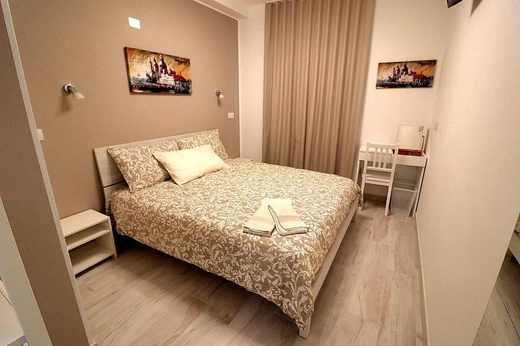 Postel nebo postele na pokoji v ubytování SENTIERI DEL GARDA