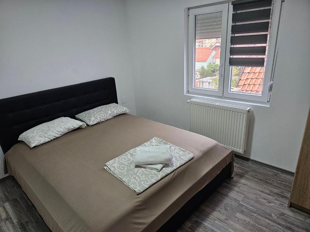 Postel nebo postele na pokoji v ubytování Akvarius