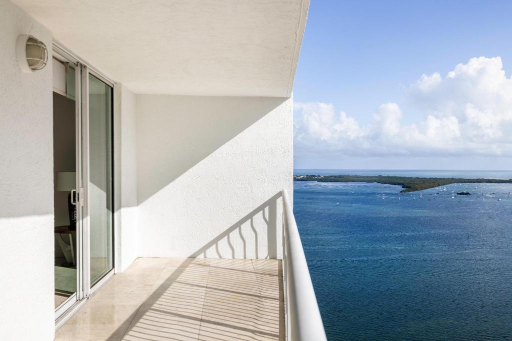 a view of the ocean from a house balcony at Luxury 1BD Apt in Downtown Brickell free parking in Miami