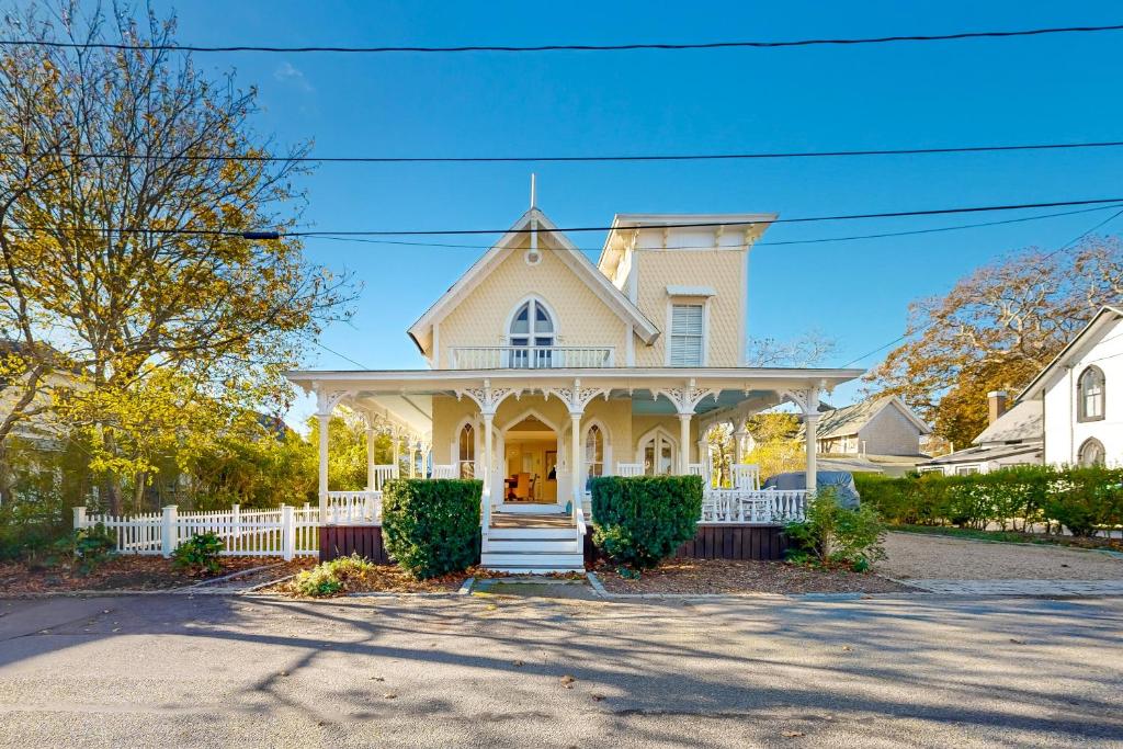 a large white house with a white porch at Victorian by the Sea in Oak Bluffs