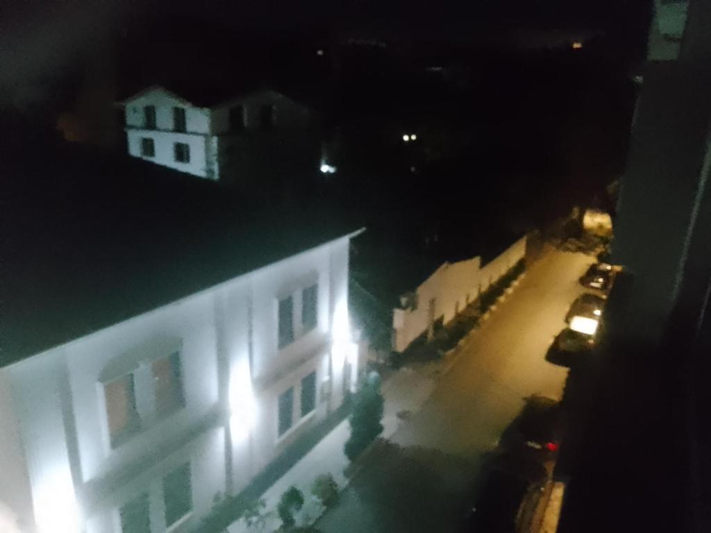 a view of a building at night with lights at Просторен и добре обзаведен апартамент Oborishte 39 str in Plovdiv
