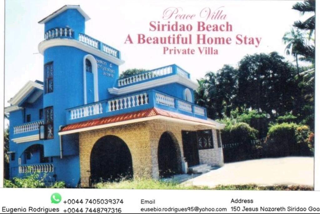 a picture of a blue house with a balcony at Luxurious 5BHK Peace Villa Siridao Goa Beach in Panaji