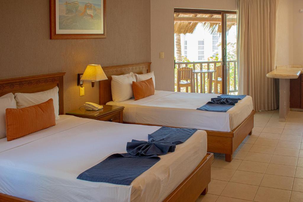 Postel nebo postele na pokoji v ubytování Tecnohotel Beach