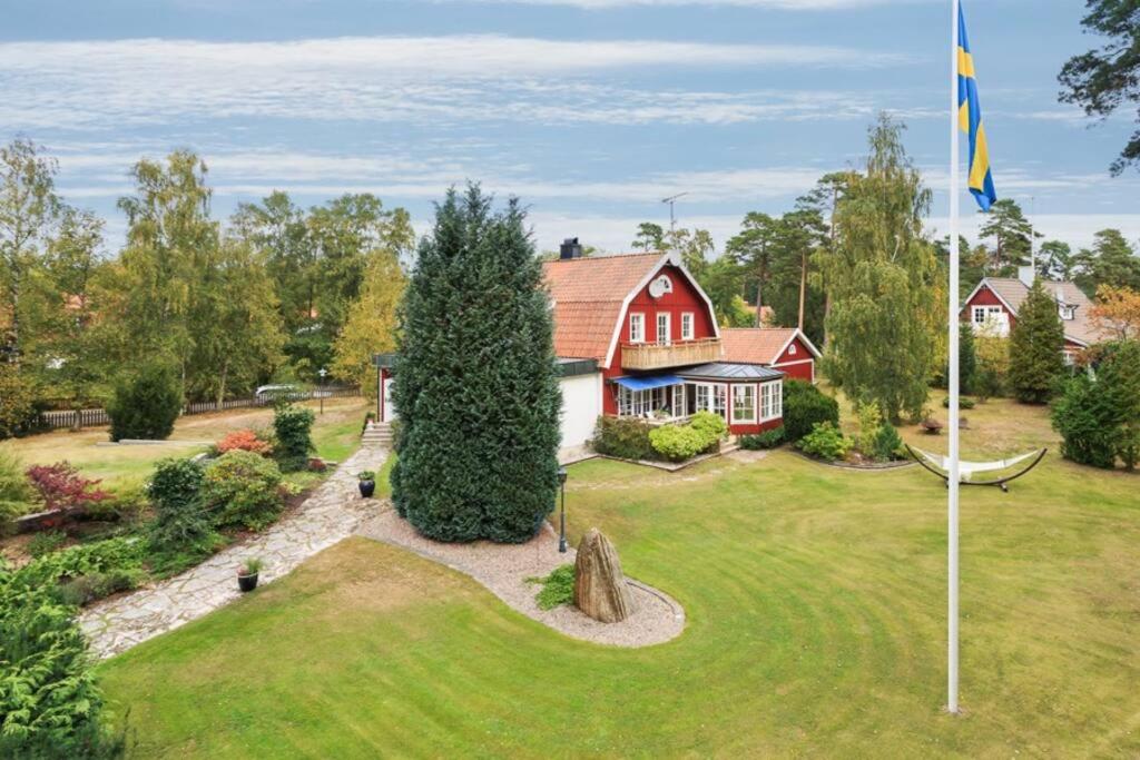 an aerial view of a house with a hammock in the yard at Beach House Ängelholm in Ängelholm