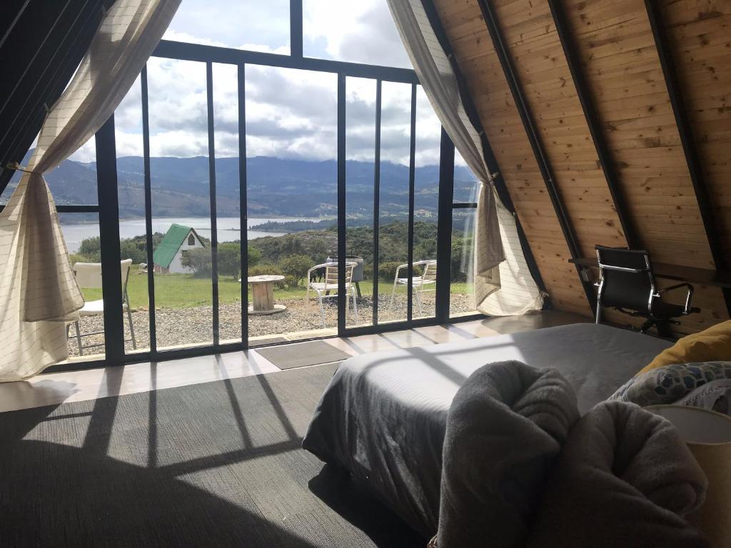 Postel nebo postele na pokoji v ubytování Refugio El Cacique
