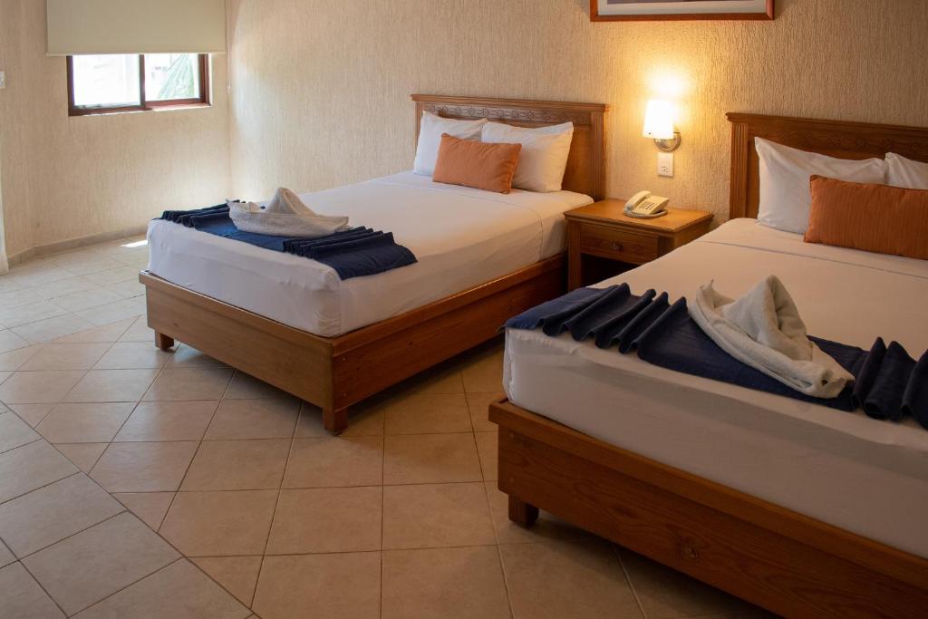 Postel nebo postele na pokoji v ubytování Tecnohotel Beach