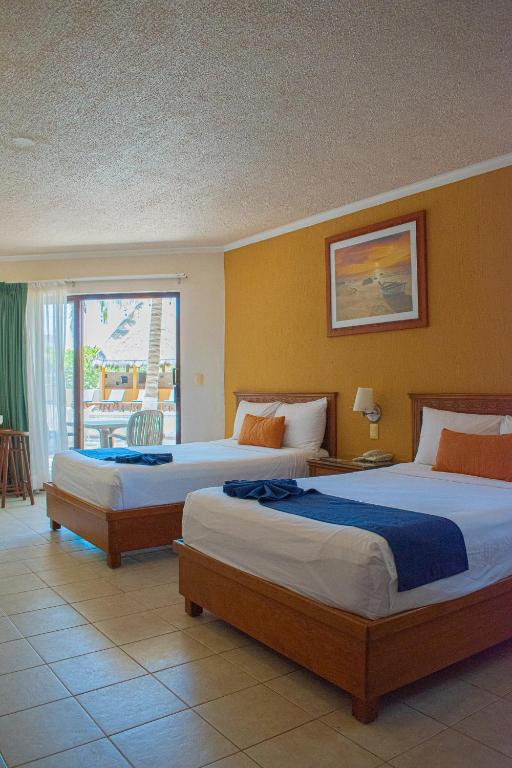 Postel nebo postele na pokoji v ubytování Tecnohotel Beach