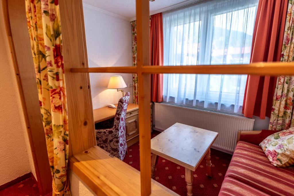 Postel nebo postele na pokoji v ubytování ARNIKA Garni