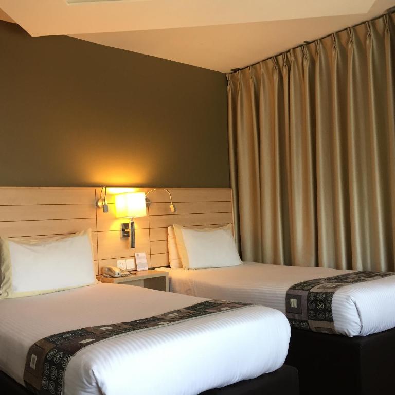 En eller flere senge i et værelse på Crystal Hotel