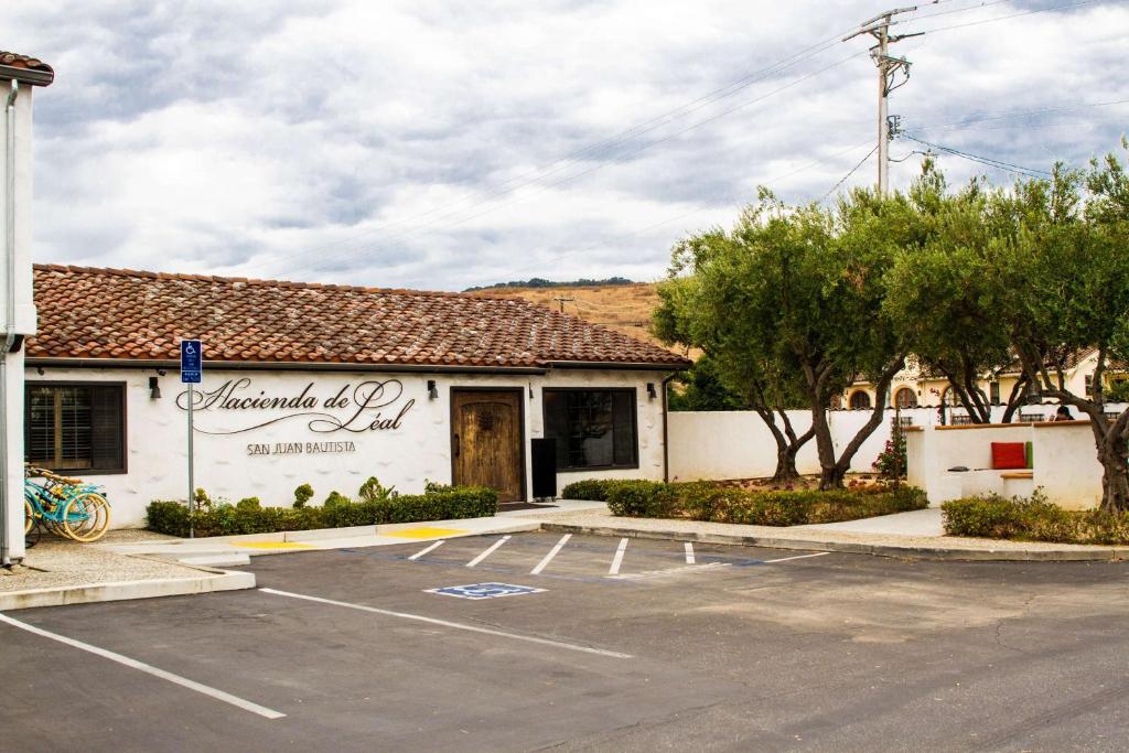 a parking lot in front of a building at Hacienda de Leal - BW Signature Collection in San Juan Bautista