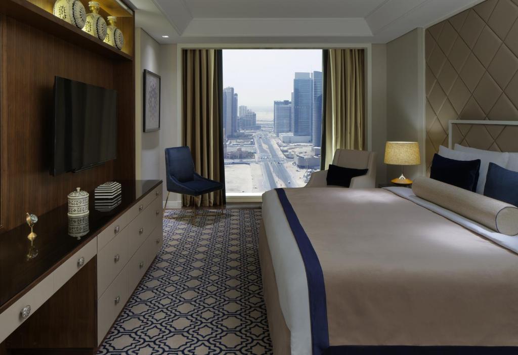 Postel nebo postele na pokoji v ubytování Taj Dubai