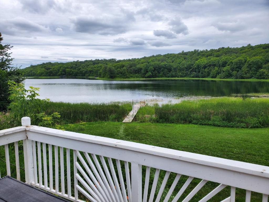 a view of a large lake from a balcony at Quaint Cabin with Private Dock in Fergus Falls