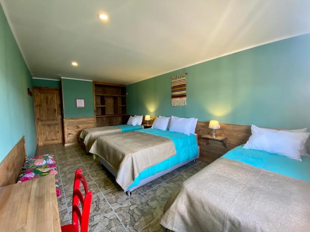 Postel nebo postele na pokoji v ubytování Hostal Esquina Patagónica