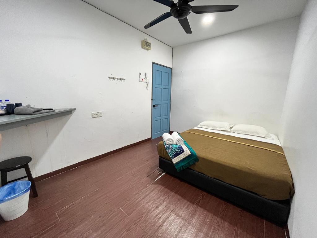 Postel nebo postele na pokoji v ubytování IBAI BEACH GUESTHOUSE