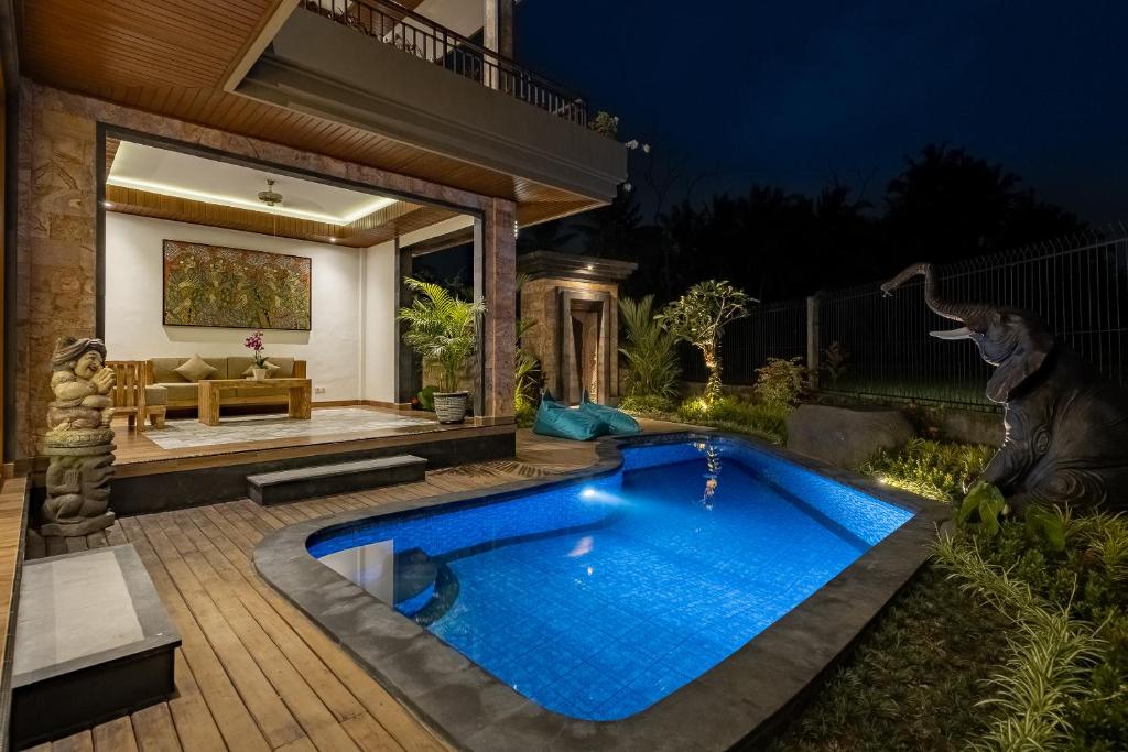 Bazén v ubytování Gynandha Ubud Cottage nebo v jeho okolí