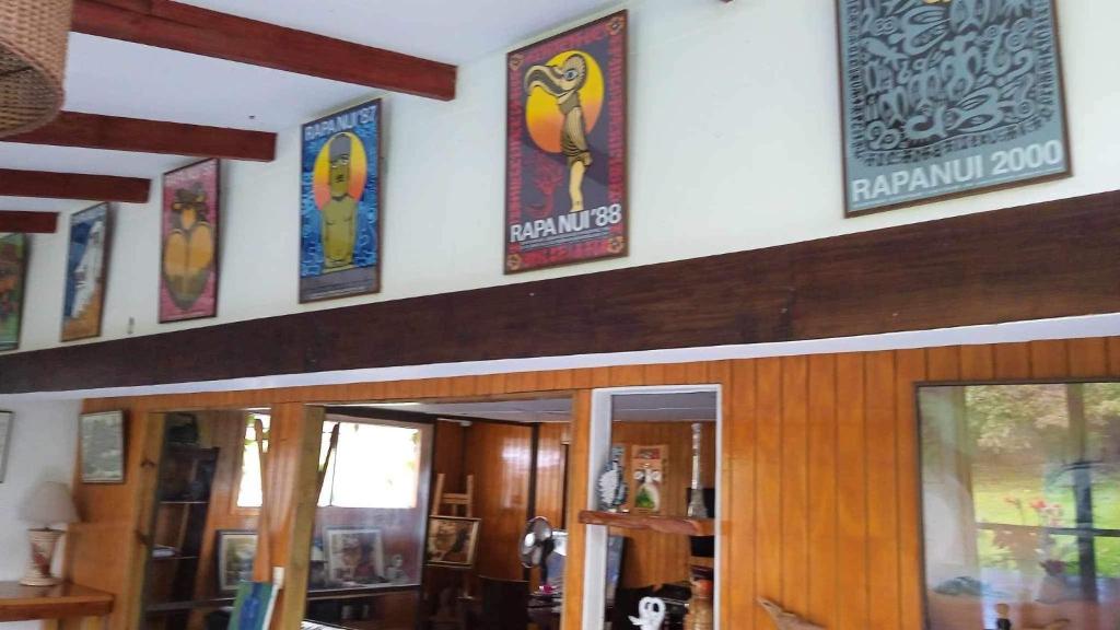a building with signs on the wall of a room at Atavai Hotel Rapa Nui in Hanga Roa