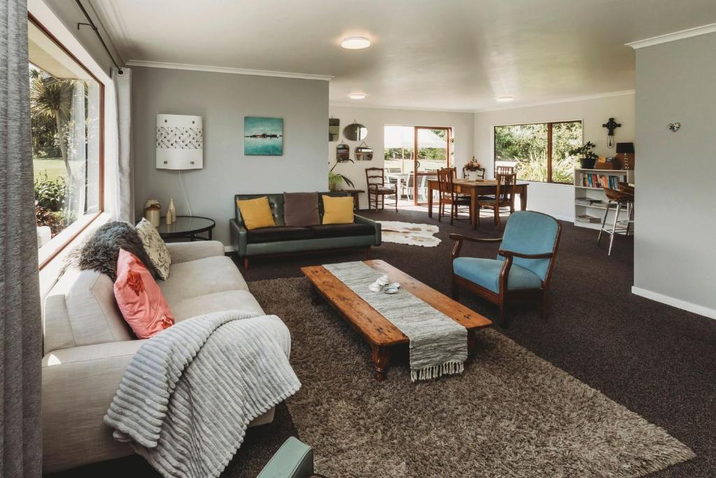 A seating area at Wharepuni Oakura Retreat