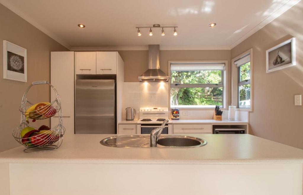 a kitchen with a sink and a counter at Great Location On Gilbert Central in New Plymouth