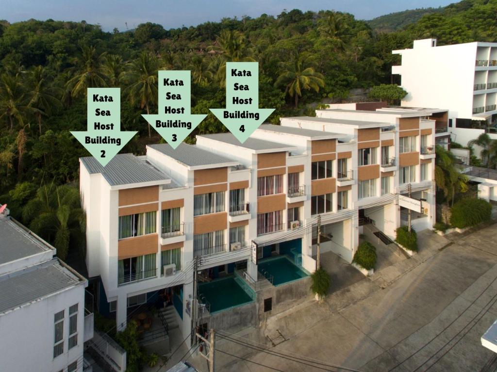 an aerial view of a building with street signs on it at Kata Sea Host in Kata Beach