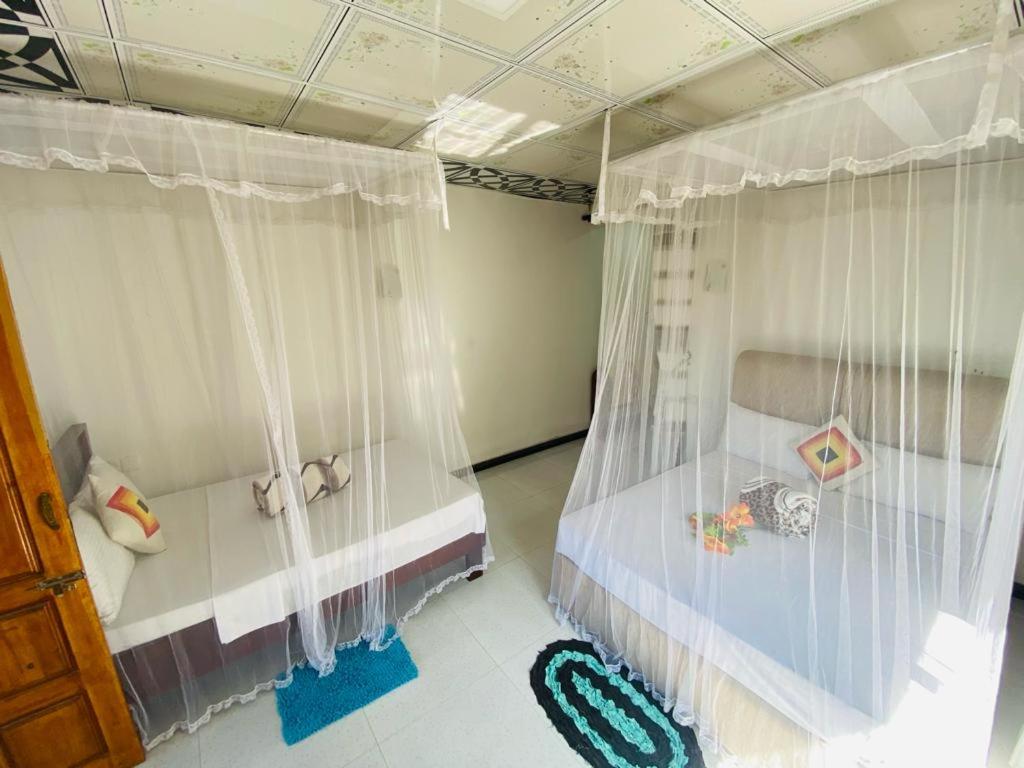 Postel nebo postele na pokoji v ubytování Mellow Homestay