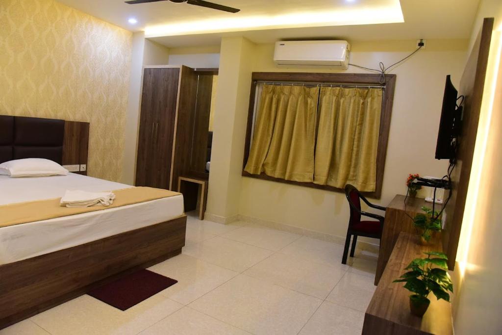 Postel nebo postele na pokoji v ubytování Hotel Guru Estate