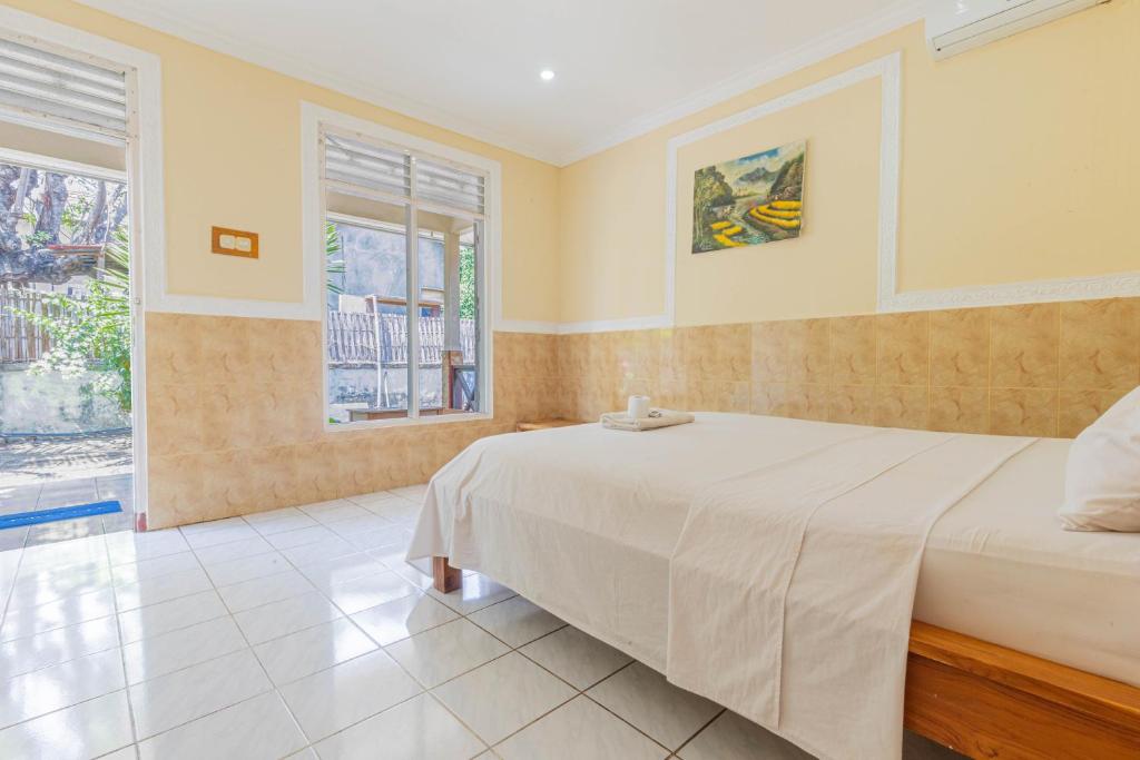 Postel nebo postele na pokoji v ubytování Homestay Lucu 2