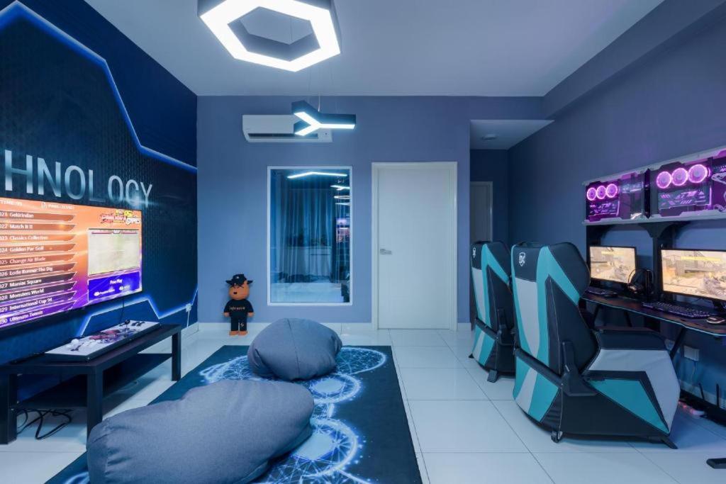 a room with a video game room with consoles at Arena Gaming Suite In Arte Mont Kiara in Kuala Lumpur