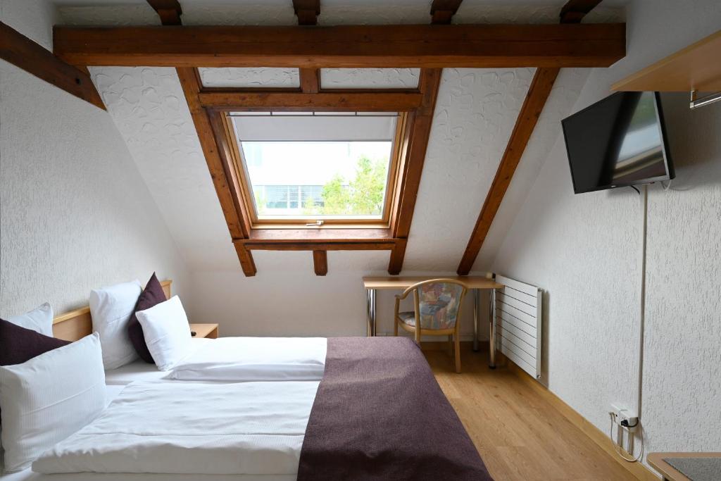 Postel nebo postele na pokoji v ubytování Olympia Hotel Zurich
