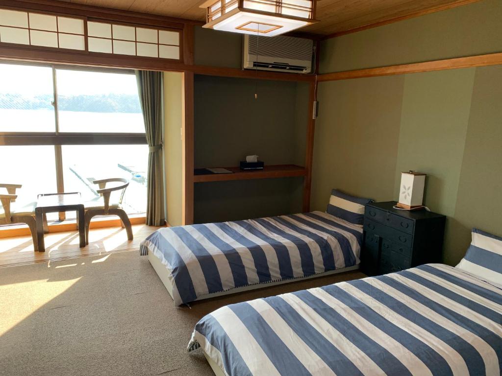 Postel nebo postele na pokoji v ubytování Nojiri Lake Resort