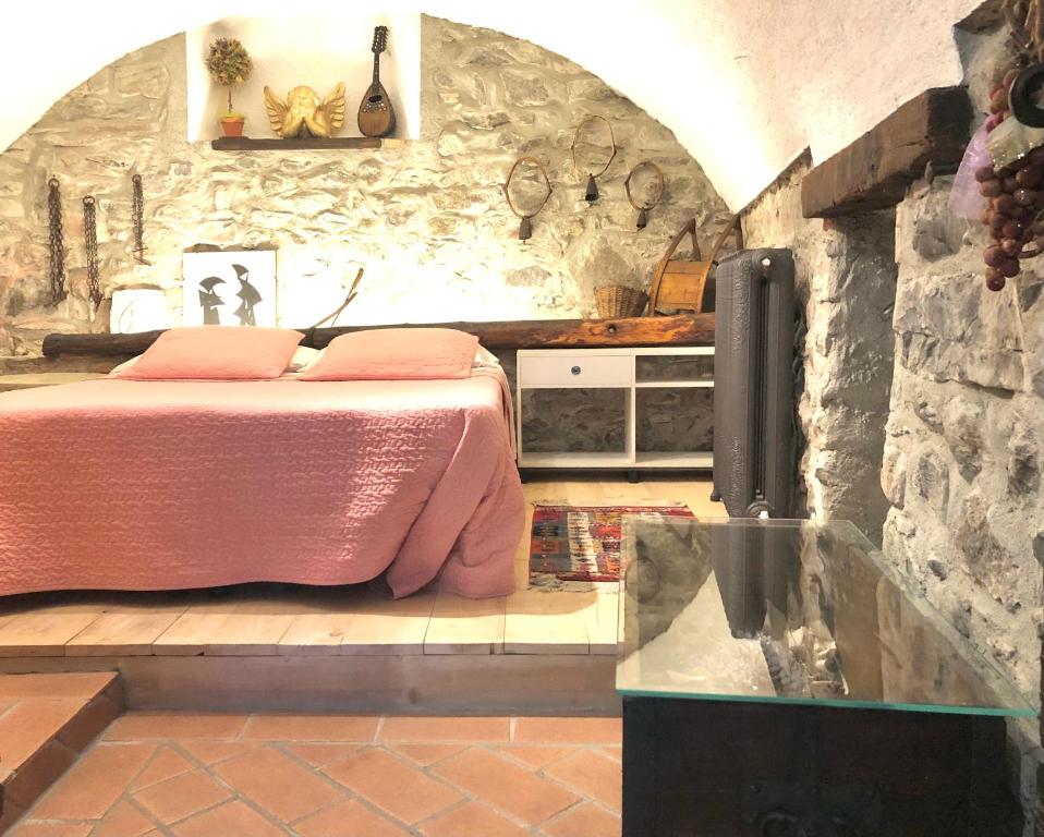 Łóżko lub łóżka w pokoju w obiekcie Appartamento Country House Menaggio