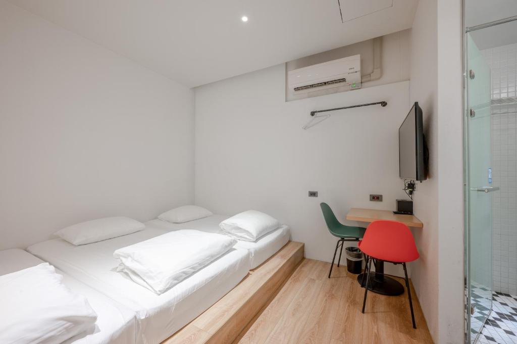 Postel nebo postele na pokoji v ubytování Light Hostel Hualien