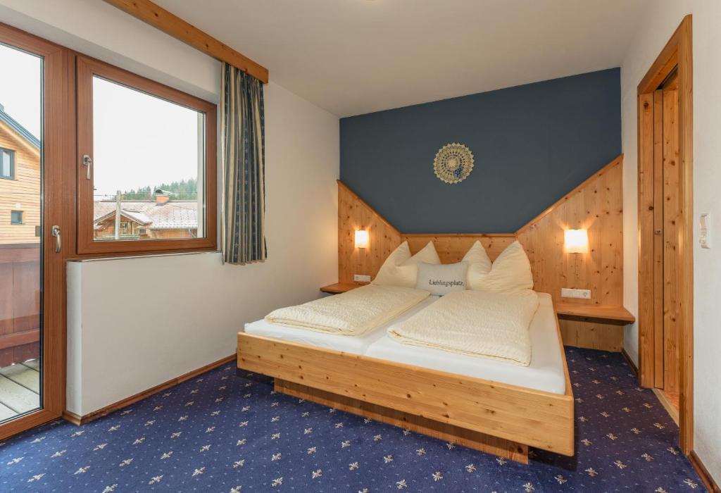 Postel nebo postele na pokoji v ubytování Gästehaus Sieder by Schladming-Appartements