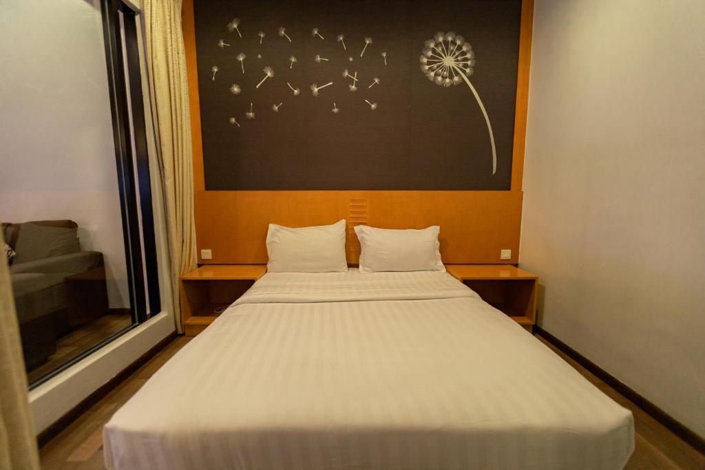 Postel nebo postele na pokoji v ubytování Hills Aranda Nova Hotel
