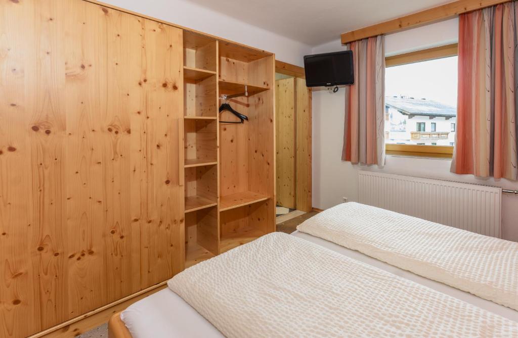 Postel nebo postele na pokoji v ubytování Gästehaus Sieder by Schladming-Appartements