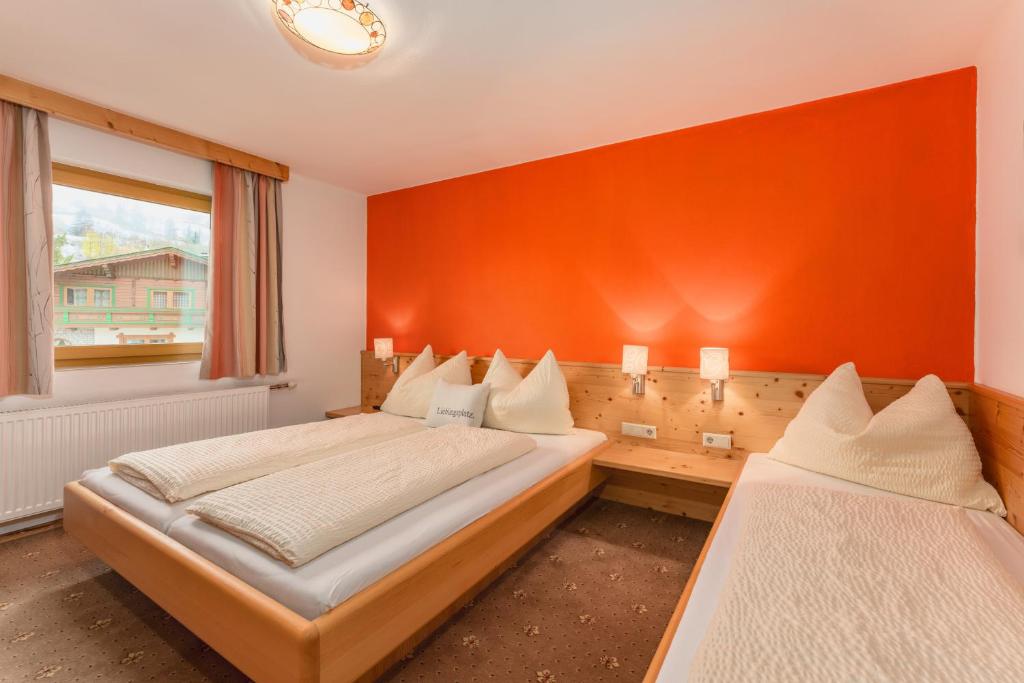 Postel nebo postele na pokoji v ubytování Gästehaus Sieder by Schladming-Appartements