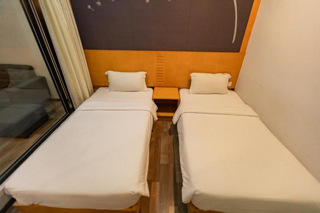 Postel nebo postele na pokoji v ubytování Hills Aranda Nova Hotel