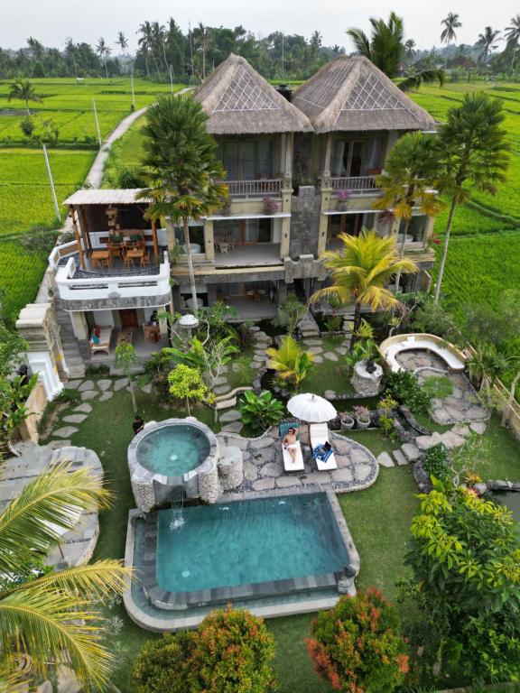 an aerial view of a house with a swimming pool at The Nenggala Suite in Tegalalang