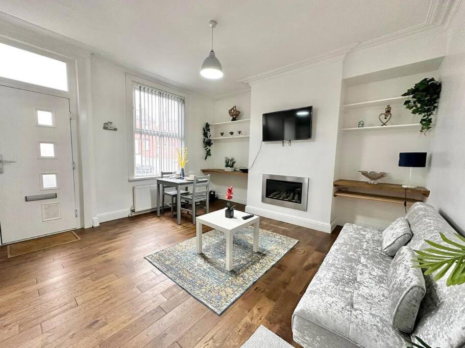 a living room with a couch and a table at (S17) Convenient 2BR Leeds - Sleeps 4 in Leeds