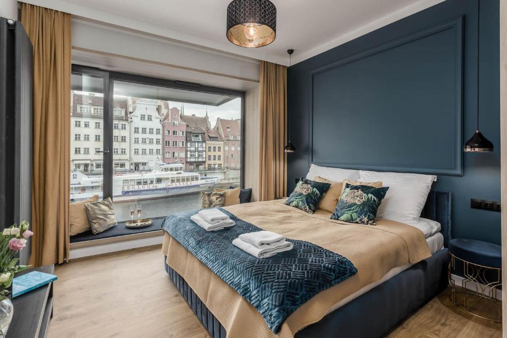 Posteľ alebo postele v izbe v ubytovaní Apartamenty DEO PLAZA by Rent like home