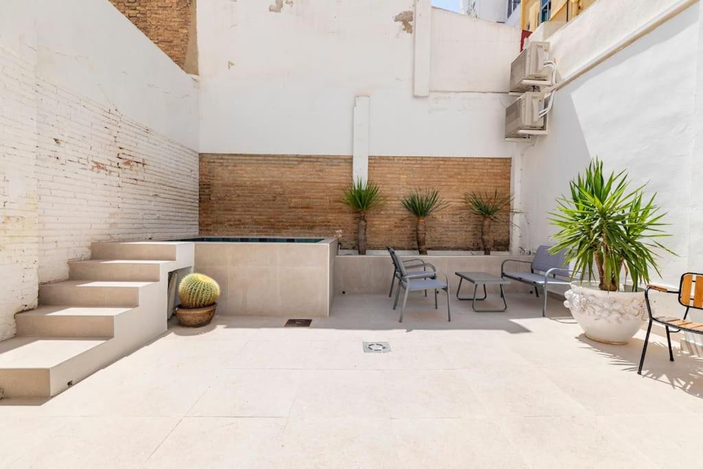 a courtyard with stairs and chairs and plants at PR27 in Valencia