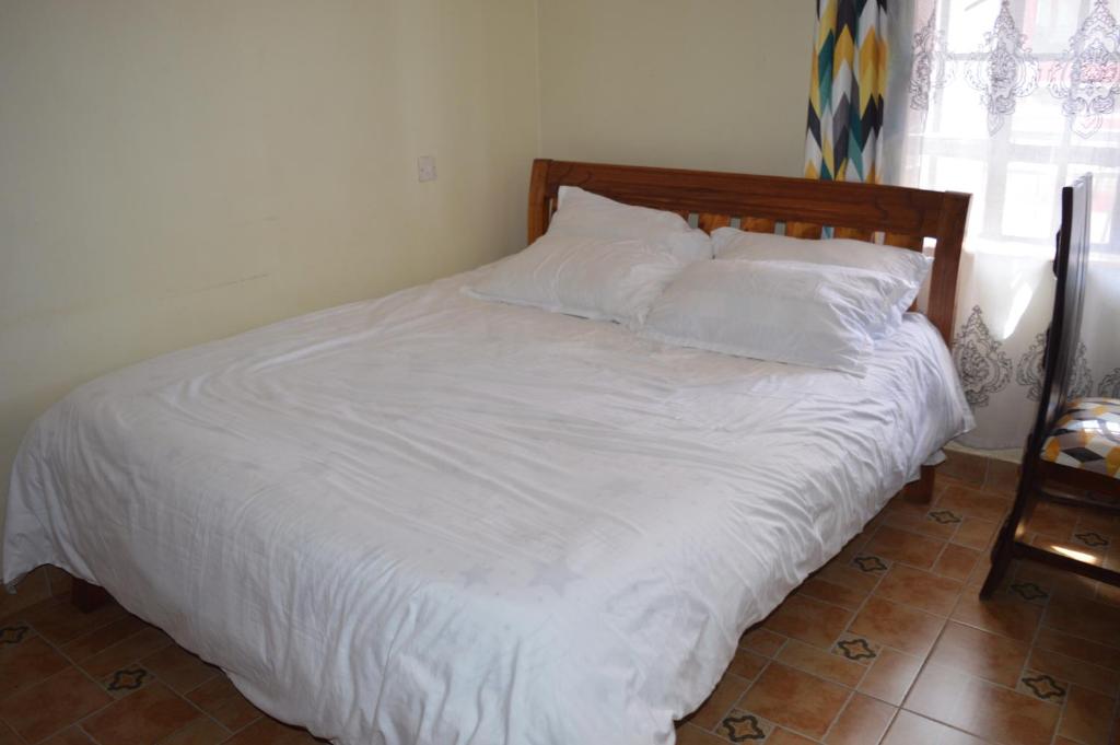 Postel nebo postele na pokoji v ubytování Modern Ruiru double deluxe, Thika Road