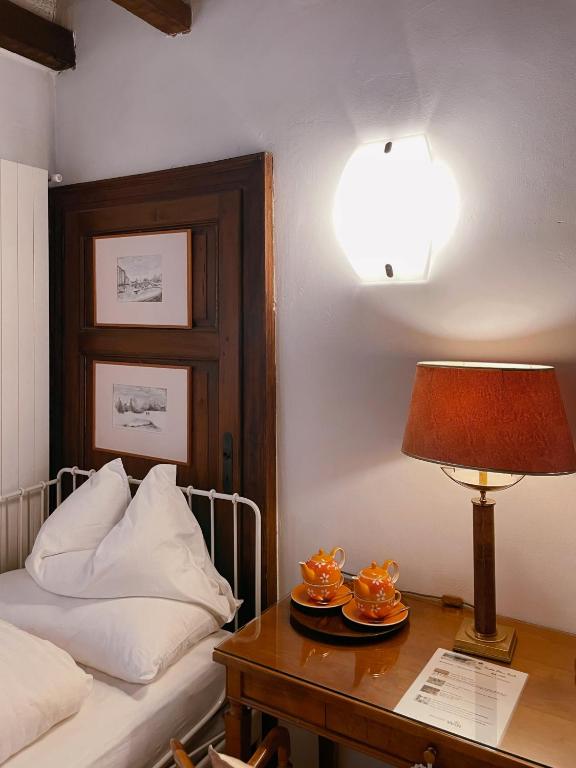 Postel nebo postele na pokoji v ubytování Grotto Flora B&B Chambres de charme