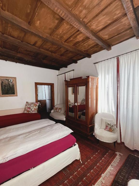 Postel nebo postele na pokoji v ubytování Grotto Flora B&B Chambres de charme