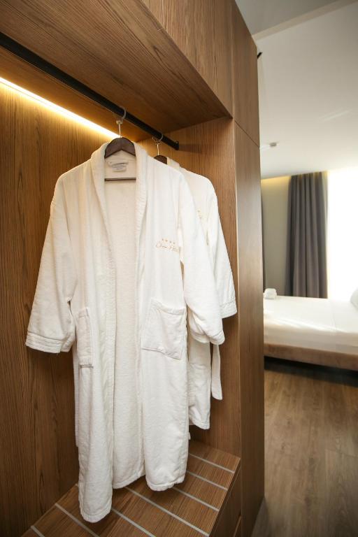 Postel nebo postele na pokoji v ubytování Charm Hotel